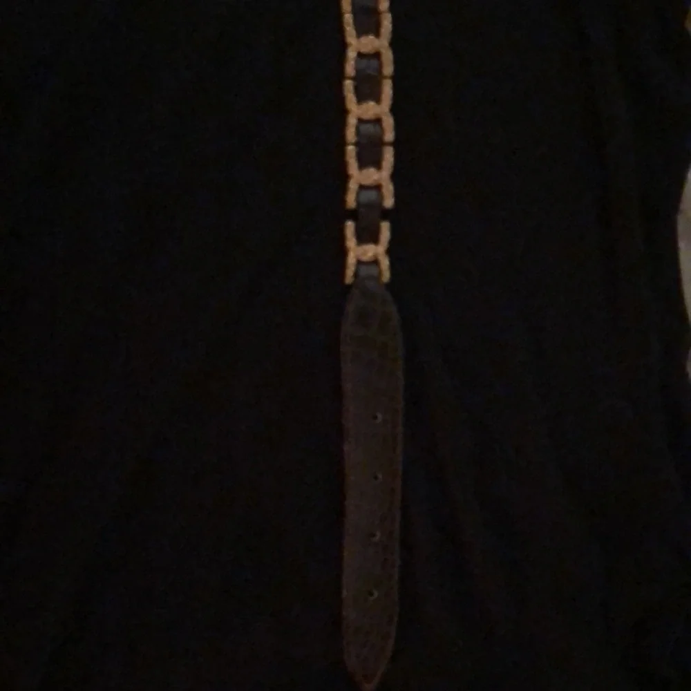 Gold and brown belt 35 inches to first hole. Size M